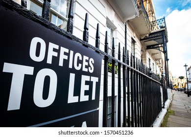 'Offices To Let' Sign On Black Railings In London's West End