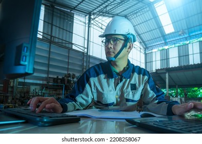 Official Engineering Industry Heavy Industrial Plant, An Industrial Engineer Working On A Personal Computer, Designing Using CAD Program.