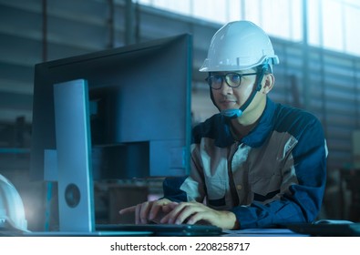 Official Engineering Industry Heavy Industrial Plant, An Industrial Engineer Working On A Personal Computer, Designing Using CAD Program.