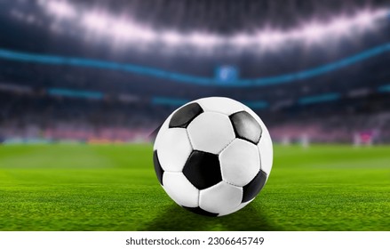Official Football Ball at stadium on green grass