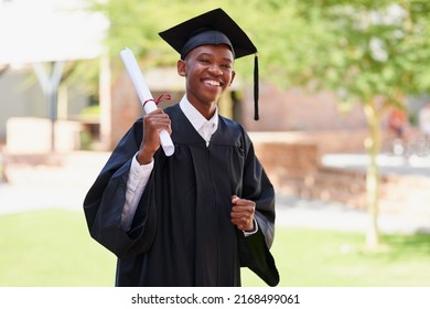 Its Official. Portrait Of A Happy Male Student Standing Outside On His Graduation Day.