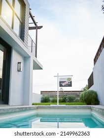 Its Officially Sold. Shot Of A Sold Sign In A Yard Of A Newly Bought House.