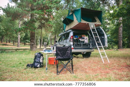 Similar – Image, Stock Photo Women resting and talking lying in tent over car