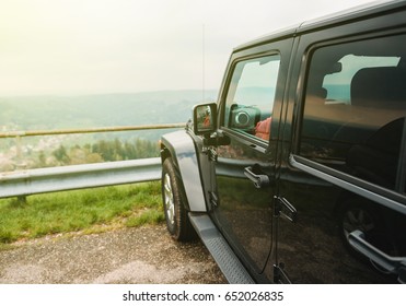 Off-road Car At The Edge Of The Mountain Highway - Car Travel On Mountain Road, Parked Near A Beautiful Overview Over The Forest