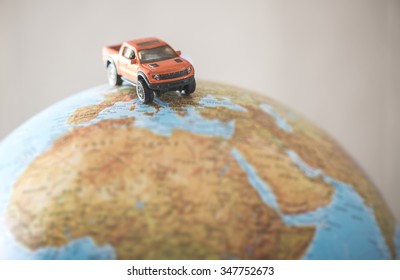 Offroad car on globe. Miniature concept - Powered by Shutterstock