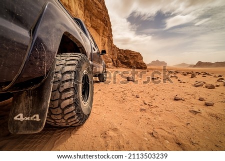 offroad car tire on the sand in real desert