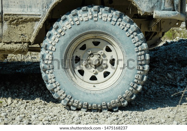Off-road dirty car wheels. Swamp rubber. \
Trial competition.