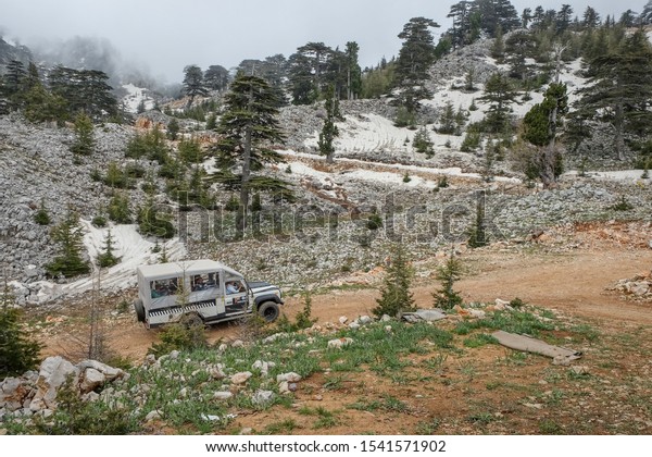 Off-road  jeep safari adventure trip  towards Taurus\
mountains a cloudy foggy day early morning. Excursion trip in the\
all-wheel drive vehicles on snow mountain roads.Kemer,\
Antalya,Turkey May\
2019