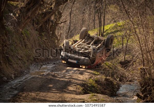 Offroad\
rollover accident, car flipped on mountain\
road