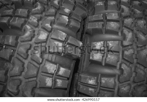 Off-road tires.  new car\
tyre. Closeup of black car tire. big jungle tire background. jungle\
trekker.