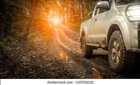 Off-road travel on mountain road, with light off sunset.
