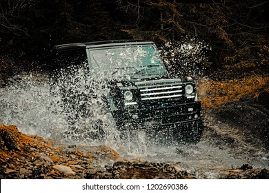 Off-road Travel On Mountain Road. Mud And Water Splash In Off The Road Racing. Drag Racing Car Burns Rubber. Extreme. Off-road Car. 4x4 Travel Trekking. Rally Racing