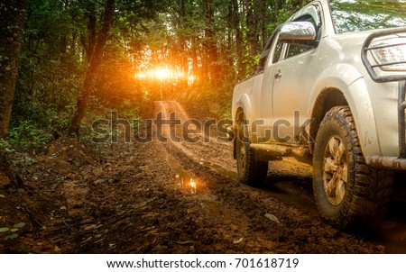 Off-road travel on mountain road. Beautiful nature sunset