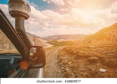 off-road travel in wild mountains. Beautiful sky landscape