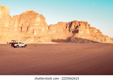 Offroad Truck Or Suv Riding Dune In Famous Wadi Rum Desert At Sunset. Offroad In Jordan Wadi Rum