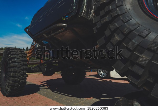 Off-road\
tuned car. Lift car. Large tires for the\
swamp