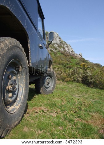 Offroad vehicle and a mountain in the background