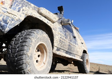 Off-road Vehicle In Muddy Terrain.  