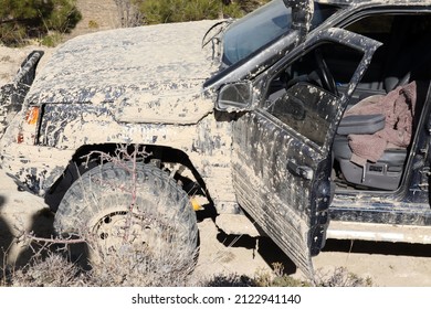 Off-road Vehicle In Muddy Terrain.  