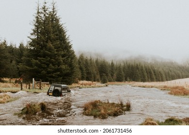 Off-roading Car Stuck In The Water Stream In Nature