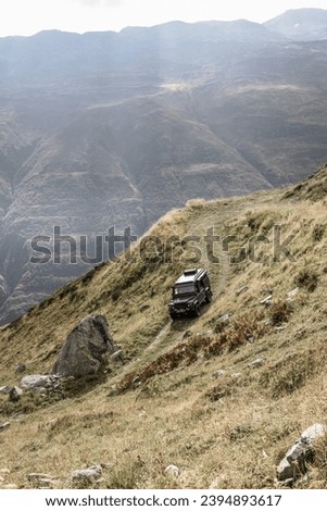 offroading with a land rover defender in the swiss alps