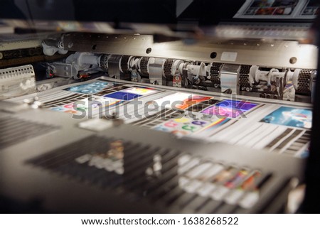 Offset printing machine, inside view, printing sheets, printing