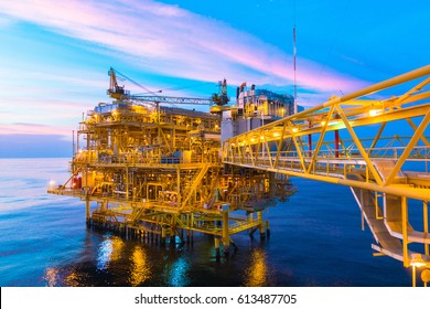 Offshore Construction Platform For Production Oil And Gas With Bridge In Evening Time