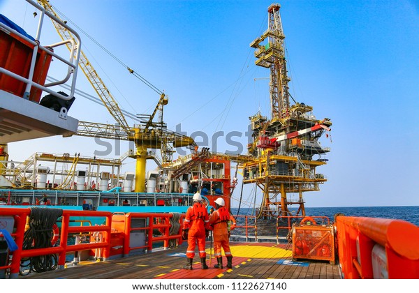 Offshore\
construction platform for production oil and gas. Oil and gas\
industry and hard work. Production platform and operation process\
by manual and auto function from control\
room.
