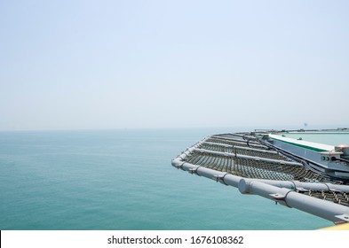 Offshore helicopter platform. Empty oil rig helipad. Sea and sky