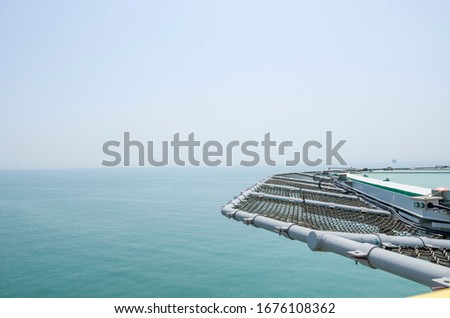 Offshore helicopter platform. Empty oil rig helipad. Sea and sky
