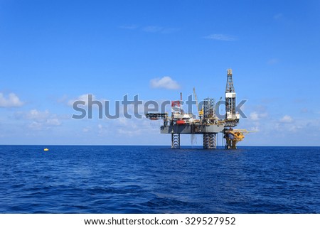 Offshore Jack Up Drilling Rig Over The Production Platform in The Middle of The Sea