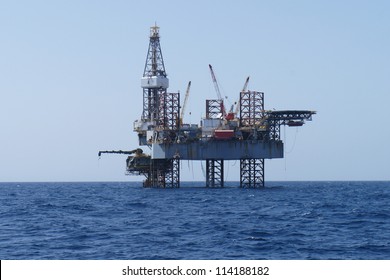 Offshore Jack Up Oil Drilling Rig and The Production Platform - Shutterstock ID 114188182