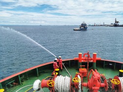 Offshore Marine Crew Testing Fire Hydrant For Fire Drill Training