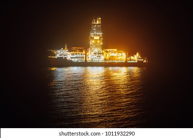 Offshore Oil Drillship At Night