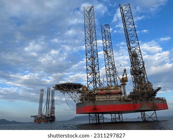 Offshore oil and gas central processing platform, Production plant under blue clear sky, petroleum and power generation plant, oil and Energy production.  - Shutterstock ID 2311297827