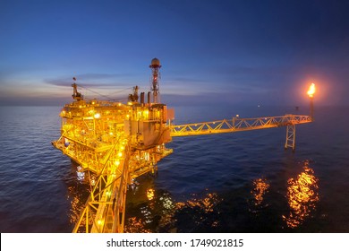 Offshore oil and gas or rig platform with beautiful sky in the evening time for oil and gas business concept.