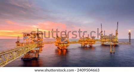 Offshore Oil and Gas Rig Platform: A Majestic Sunset Over the Sea