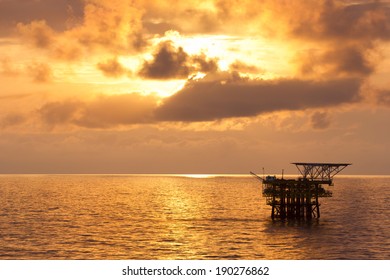 An Offshore Oil Platform At Sunrise