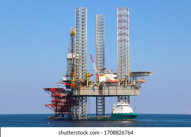 Offshore Oil Platform And Supply Ship Are In Persian Gulf. United Arab Emirates