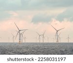 Offshore and Onshore Windmill farm Westermeerwind, Windmill park in the Netherlands with huge large wind turbines, group of windmills for renewable electric energy