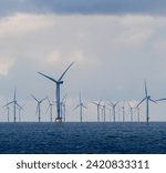 Offshore and Onshore Windmill farm Westermeerwind, Windmill park in the Netherlands with huge large wind turbines, group of windmills for renewable electric energy