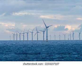 Offshore and Onshore Windmill farm Westermeerwind, Windmill park in the Netherlands with huge large wind turbines, group of windmills for renewable electric energy - Shutterstock ID 2233237107