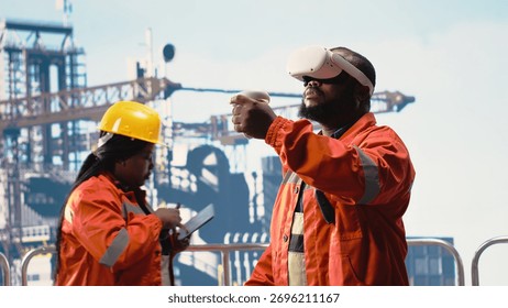 Offshore rig worker supervising deck operations using virtual reality simulation, ensuring compliance with safety protocols. Engineer doing checkup on drilling rig with VR goggles