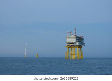 Offshore Substation and Wind Turbine in Open Sea During Renewable Energy Development, Wind Farm Construction Maintenance