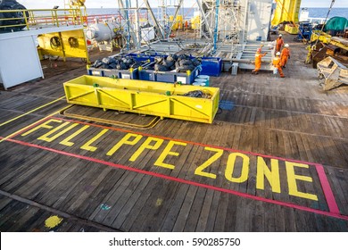 Offshore Terengganu, Malaysia. August 2015. View of a main deck of a construction barge at oilfield Terengganu with signage of 'FULL PPE ZONE'