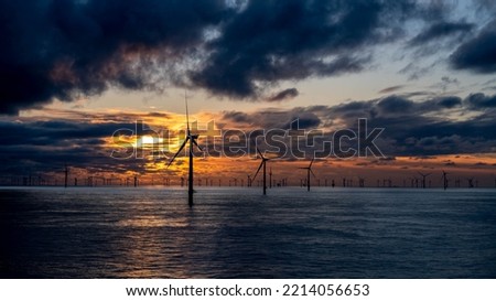 Offshore wind farm autumn sunset.