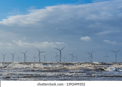 Offshore Wind Farm On The Uk Coast. Alternative Power Generation.