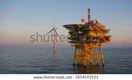 Offshore wind farm substation with turbine in North Sea
