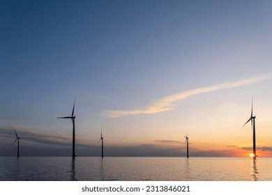 offshore wind farm at sunset - Shutterstock ID 2313846021
