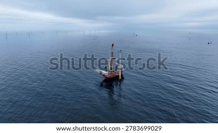 Offshore wind turbine assembly process with lattice crane